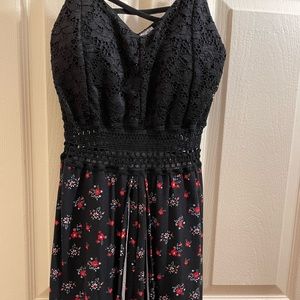 Size XS (1). Black with red and white flowers.